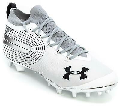 gold and white under armour football cleats